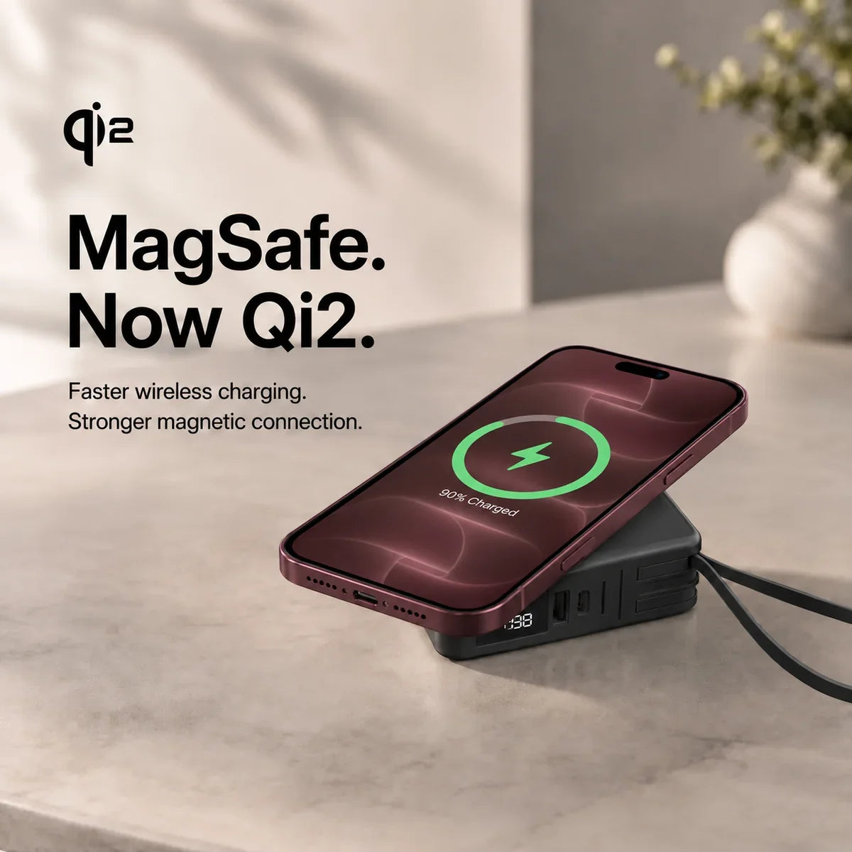 Midnight Black travel power bank charging a Burgundy phone magnetically. #color_Midnight Black