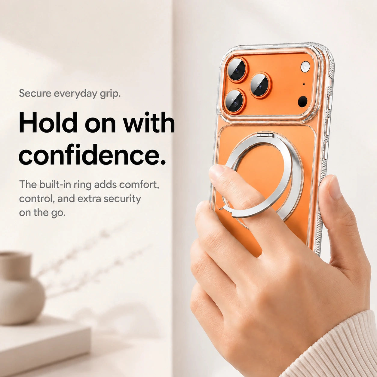 Clear magnetic phone case held with a finger through the adjustable ring grip #color_Transparent
