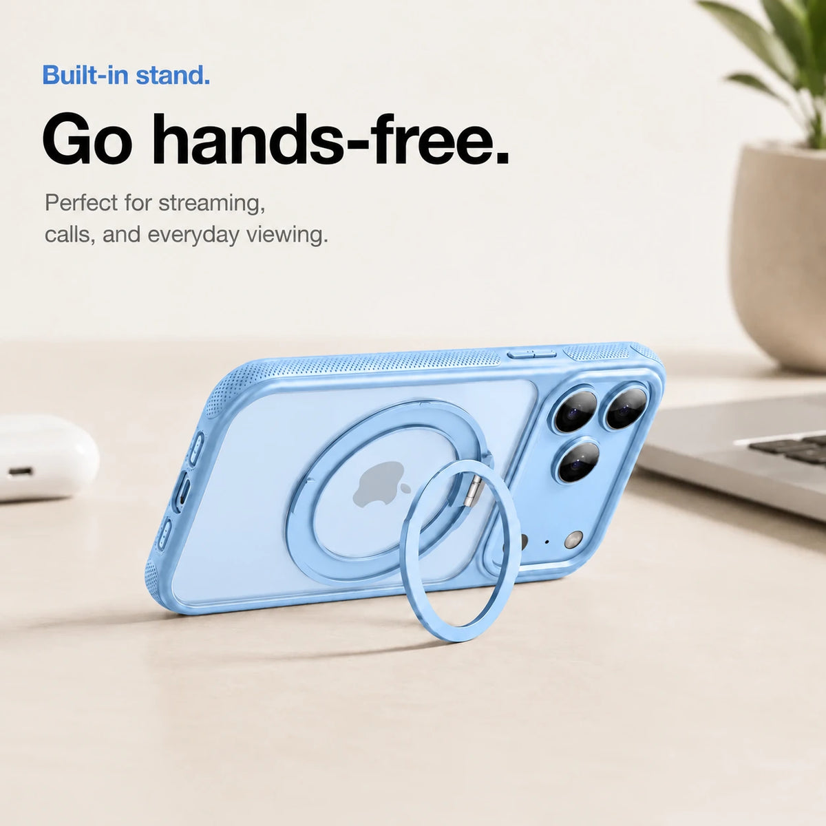 Light blue magnetic phone case propped horizontally on its ring stand beside a laptop #color_Light Blue