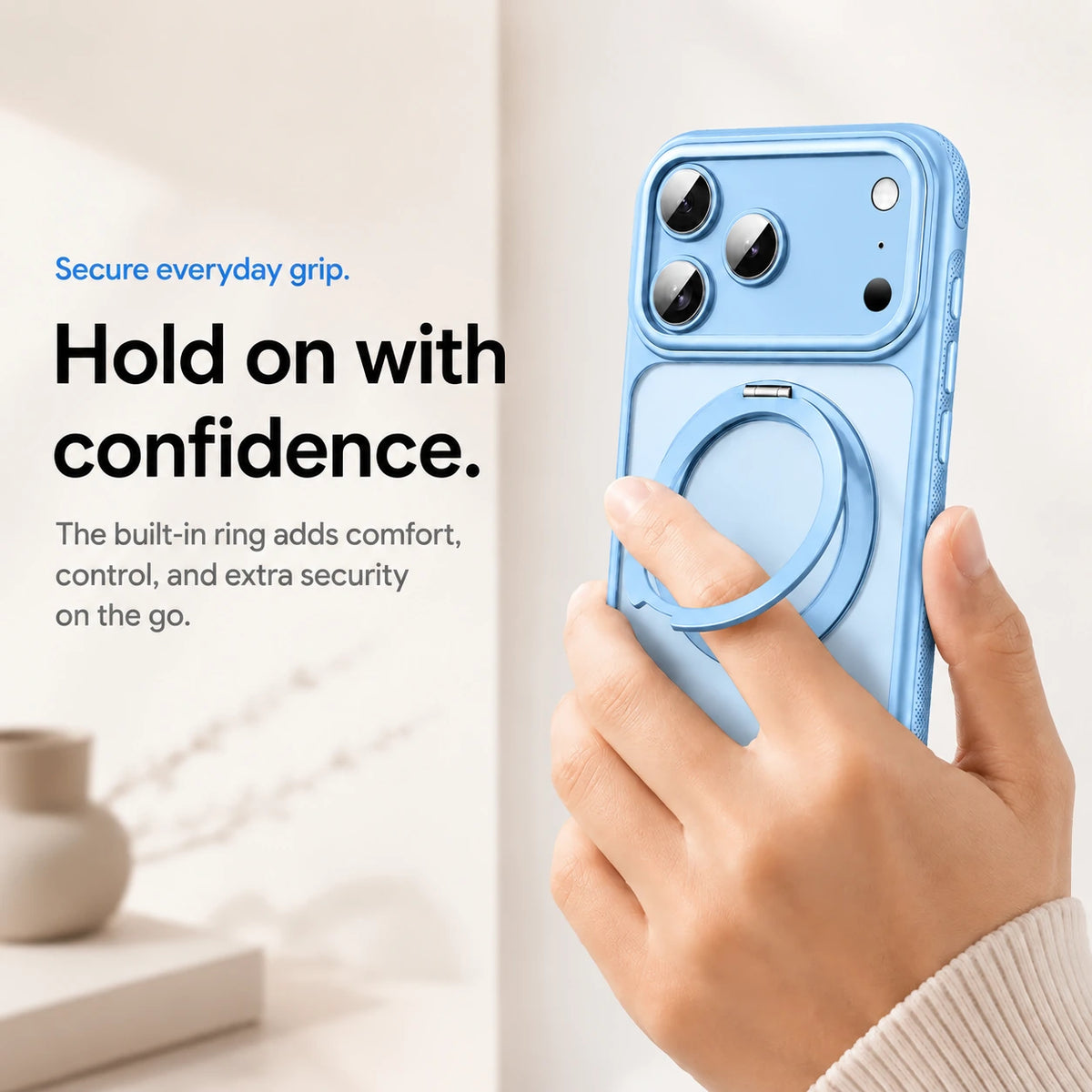 Light blue magnetic phone case held with a finger through the adjustable ring grip #color_Light Blue