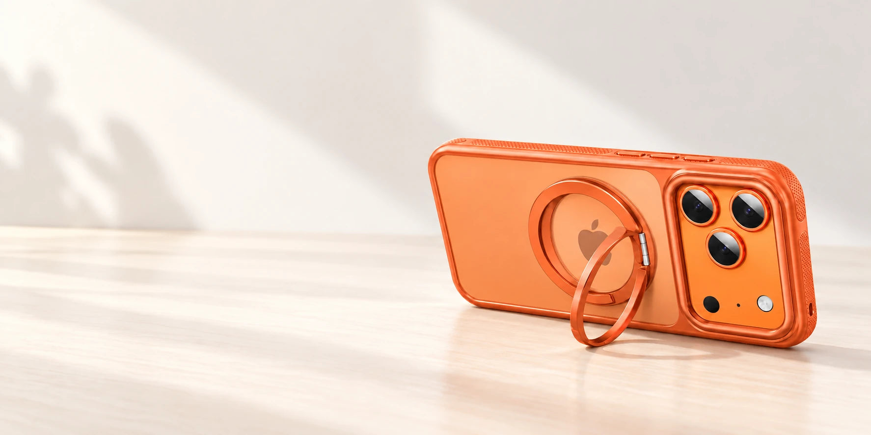 Phone case resting in landscape with its original ring supporting it from the side.